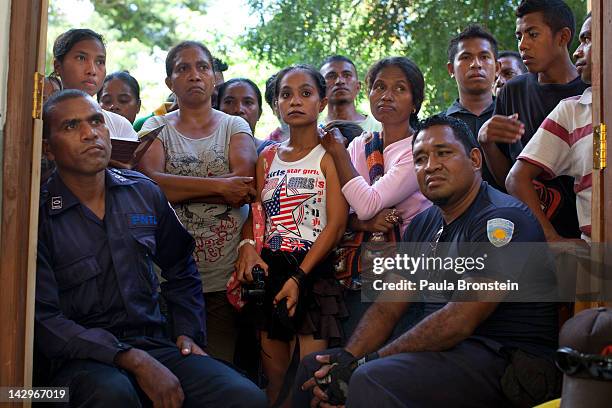 East Timorese and local police watch the counting of ballots as the counting continues in the run-off Presidential elections on April 16, 2012 in...