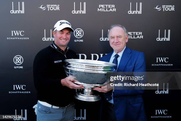 Ryan Fox of New Zealand is presented with the trophy by Peter Dawson after winning the Alfred Dunhill Links Championship on the Old Course St....