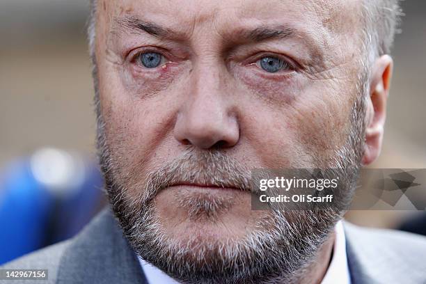George Galloway appears for a photograph in front of the Houses of Parliament prior to being sworn in as a member of parliament on April 16, 2012 in...