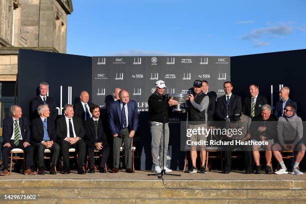 Ryan Fox of New Zealand is presented with the trophy after winning the Alfred Dunhill Links Championship on the Old Course St. Andrews on October 02,...