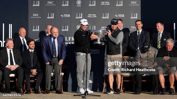 Ryan Fox of New Zealand is presented with the trophy after winning the Alfred Dunhill Links Championship on the Old Course St. Andrews on October 02,...