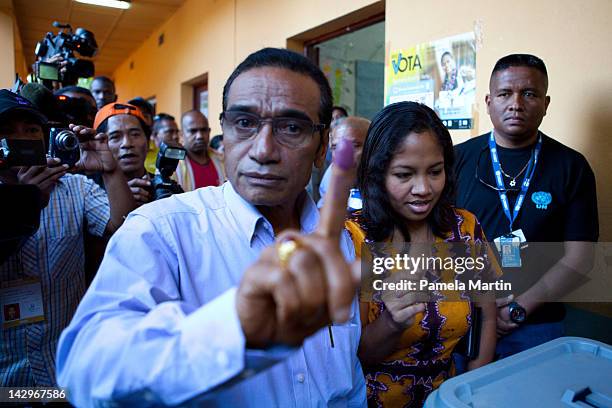 Francisco Lu Olo Guterres shows the ink on his finger after casting his vote in the second round of the Presidential elections on April 16, 2012 in...