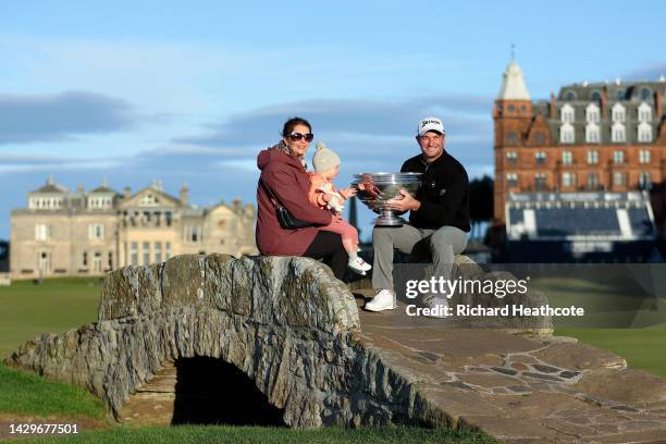 Ryan Fox of New Zealand poses with the trophy on the Swilcan Bridge alongside their Wife, Anneke, after winning the Alfred Dunhill Links Championship...