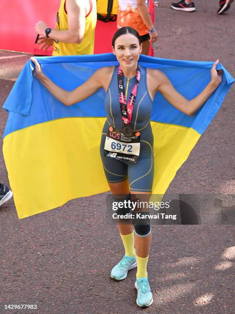 Viktoriia Kiose, Miss Ukraine 2016, completes the 2022 TCS London Marathon on The Mall on October 02, 2022 in London, England.