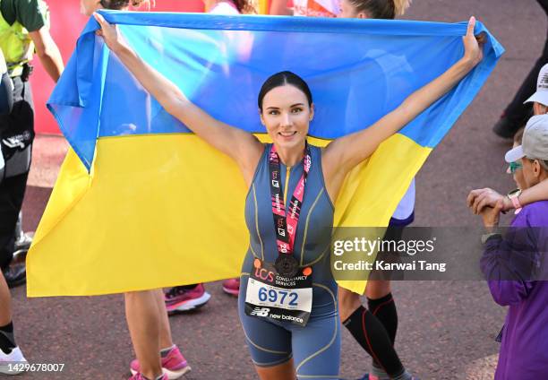 Viktoriia Kiose, Miss Ukraine 2016, completes the 2022 TCS London Marathon on The Mall on October 02, 2022 in London, England.