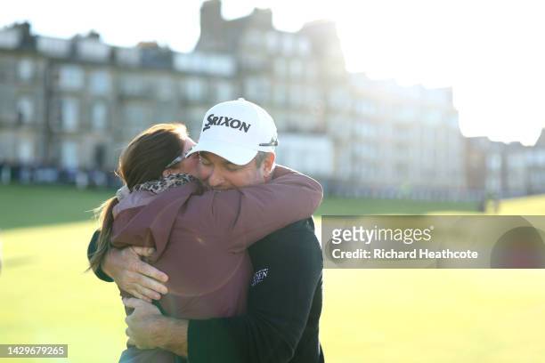Ryan Fox of New Zealand embraces their Wife, Anneke after finishing their round on Day Four of the Alfred Dunhill Links Championship on the Old...