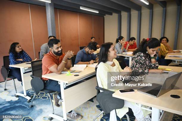 large group of students smiling and studying together in the classroom - indian society and daily life stockfoto's en -beelden