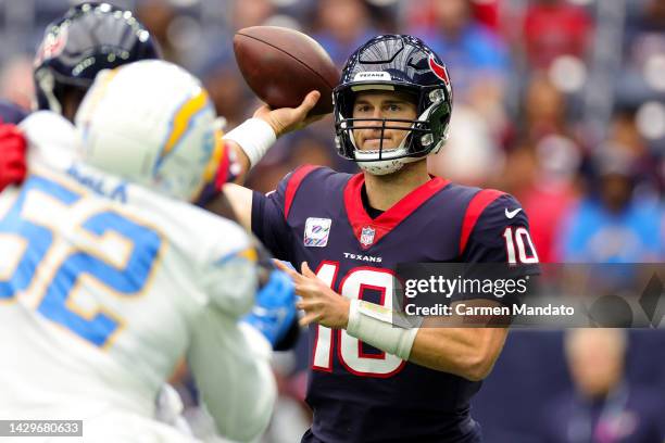 Davis Mills of the Houston Texans throws a pass in the first quarter against the Los Angeles Chargers at NRG Stadium on October 02, 2022 in Houston,...