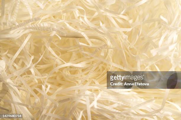 shredded white paper for eco friendly packaging. modern business for a healthy of the planet - biodegradable stock pictures, royalty-free photos & images