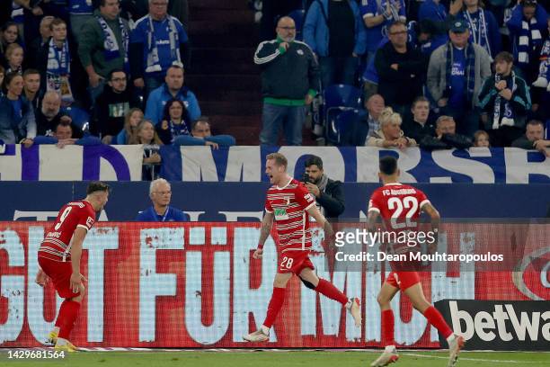 Andre Hahn of Augsburg celebrates their sides third goal during the Bundesliga match between FC Schalke 04 and FC Augsburg at Veltins-Arena on...