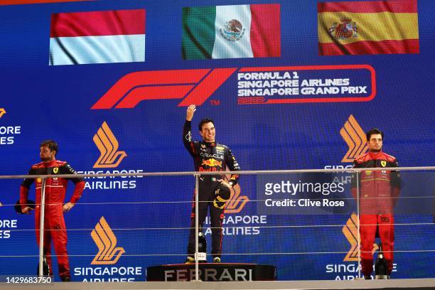 Race winner Sergio Perez of Mexico and Oracle Red Bull Racing , Second placed Charles Leclerc of Monaco and Ferrari and Third placed Carlos Sainz of...