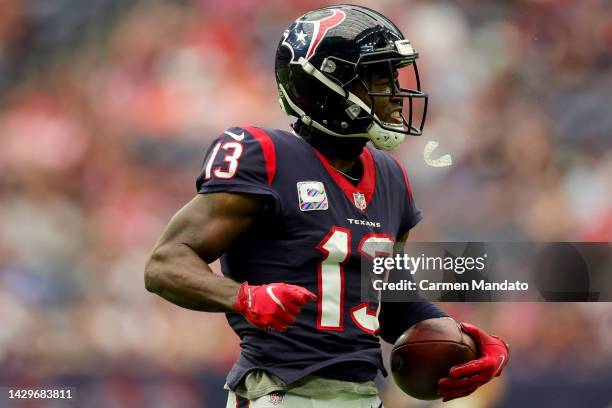 Brandin Cooks of the Houston Texans reacts after making a catch in the first quarter against the Los Angeles Chargers at NRG Stadium on October 02,...