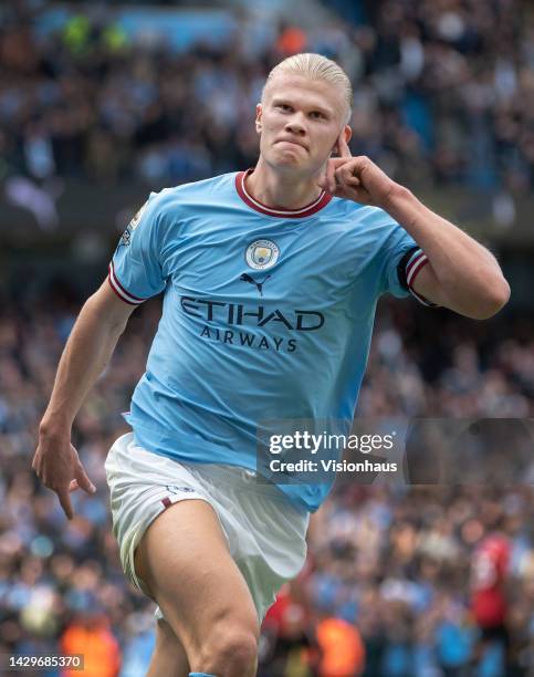 Erling Haaland of Manchester City celebrates scoring his second goal of a hat trick during the Premier League match between Manchester City and...