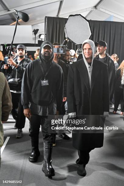 Kanye West and designer Matthew Williams attend the Givenchy Womenswear Spring/Summer 2023 show as part of Paris Fashion Week on October 02, 2022 in...