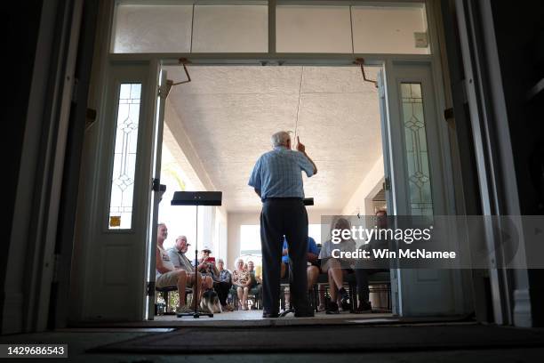 Pastor Bob Kasten delivers his sermon during Sunday services outside the Southwest Baptist Church which was damaged during Hurricane Ian on October...