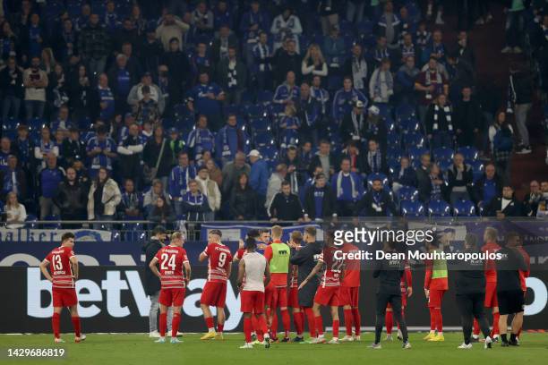Players of Augsburg interact with the crowd following the Bundesliga match between FC Schalke 04 and FC Augsburg at Veltins-Arena on October 02, 2022...