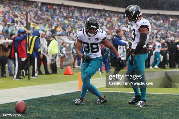 Jamal Agnew of the Jacksonville Jaguars and Christian Kirk of the Jacksonville Jaguars celebrate Agnew's touchdown during the first quarter against...