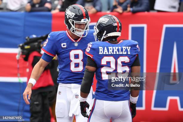 Daniel Jones of the New York Giants celebrates his touchdown with Saquon Barkley of the New York Giants in the first half of the game against the...