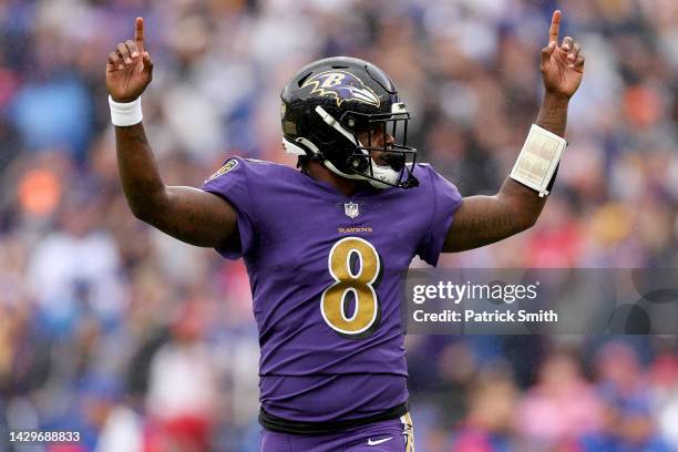 Lamar Jackson of the Baltimore Ravens celebrates after J.K. Dobbins scored a touchdown in the first quarter against the Buffalo Bills at M&T Bank...