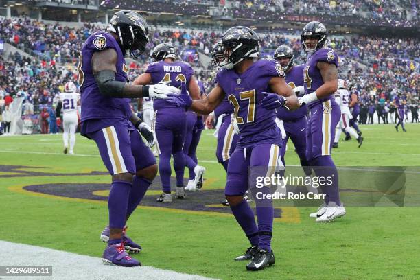 Dobbins of the Baltimore Ravens celebrates with teammates after scoring a touchdown in the first quarter against the Buffalo Bills at M&T Bank...