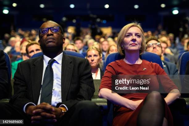 Chancellor of the Exchequer Kwasi Kwarteng and Britain's Prime Minister Liz Truss watch a tribute to Queen Elizabeth II on the opening day of the...
