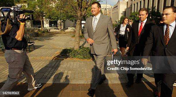 Former all-star baseball pitcher Roger Clemens and mebers of his legal team arrive at the U.S. District Court for the first day of jury selection in...