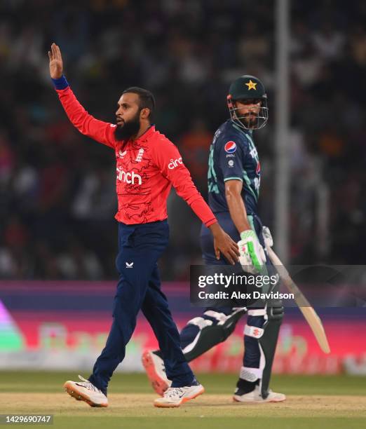 Adil Rashid of England celebrates the wicket of Khushdil Shah of Pakistan during the 7th IT20 match between Pakistan and England at Gaddafi Stadium...