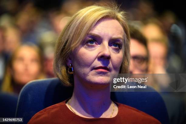 British Prime Minister Liz Truss watches a tribute to Queen Elizabeth II on day one of the annual Conservative Party conference on October 02, 2022...