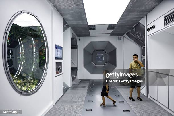 The visitor look at model of space station during Explore CASCI ART Exhibition on October 2, 2022 in Wuhan, Hubei province, China. China is...