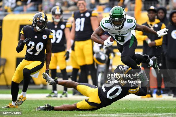 Elijah Moore of the New York Jets runs with the ball while being tackled by Cameron Sutton of the Pittsburgh Steelers in the first quarter at...