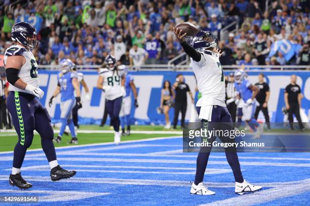 Geno Smith of the Seattle Seahawks celebrates after scoring a touchdown during the first quarter of the game against the Detroit Lions at Ford Field...
