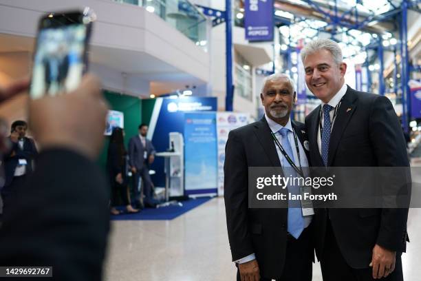 Brandon Lewis CBE MP, Lord Chancellor, and Secretary of State for Justice poses for a photograph with a delegate on the first day of the Conservative...