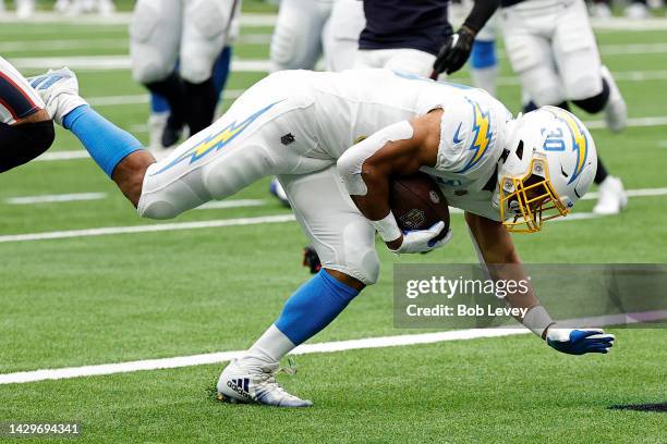 Austin Ekeler of the Los Angeles Chargers scores a touchdown in the second quarter against the Houston Texans at NRG Stadium on October 02, 2022 in...