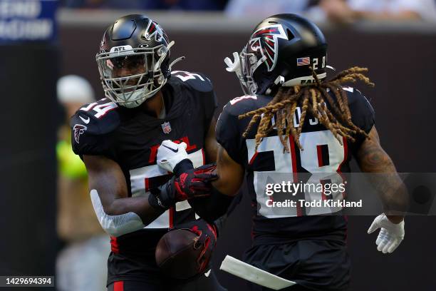 Rashaan Evans of the Atlanta Falcons celebrates recovering a fumble with Mike Ford during the first quarter of the game against the Cleveland Browns...