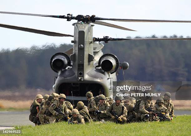 Soldiers from The Royal Regiment of Scotland exit a Chinook helicopter during the 16 Air Assault Brigade Exercise Joint Warrior at West Freugh...