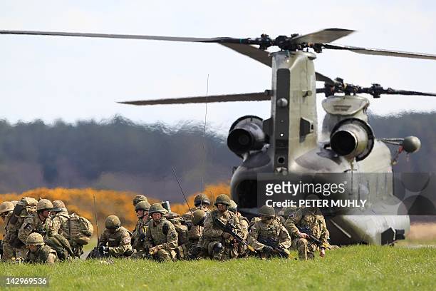 Soldiers from The Royal Regiment of Scotland exit a Chinook helicopter during the 16 Air Assault Brigade Exercise Joint Warrior at West Freugh...