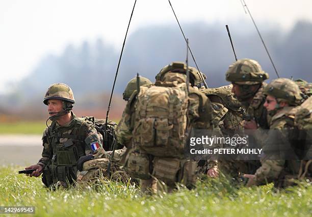 French soldier from the 11th Para brigade join soldiers from The Royal Regiment of Scotland after exiting a Chinook helicopter during the 16 Air...