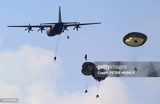 British soldiers from the 3rd Parachute Brigade jump from a C130 Hercules plane during the 16 Air Assault Brigade Exercise Joint Warrior at West...