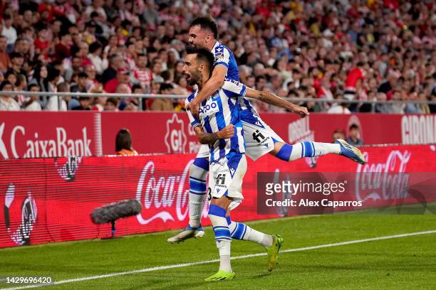 Brais Mendez of Real Sociedad celebrates after scoring Real Sociedad third goal with Alex Sola during the LaLiga Santander match between Girona FC...