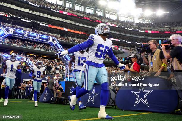 Dante Fowler Jr. #56 of the Dallas Cowboys runs onto the field before his team's game against the Washington Commanders at AT&T Stadium on October...
