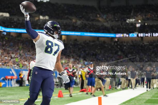 Noah Fant of the Seattle Seahawks celebrates scoring a touchdown in the second quarter of the game against the Detroit Lions at Ford Field on October...