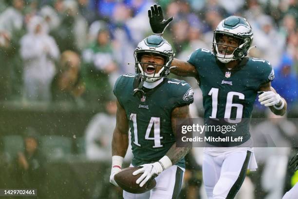 Kenneth Gainwell of the Philadelphia Eagles and Quez Watkins of the Philadelphia Eagles celebrate after Gainwell's touchdown during the second...