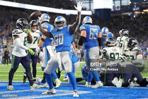 Jamaal Williams of the Detroit Lions celebrates a touchdown at the end of the second quarter of the game against the Seattle Seahawks at Ford Field...