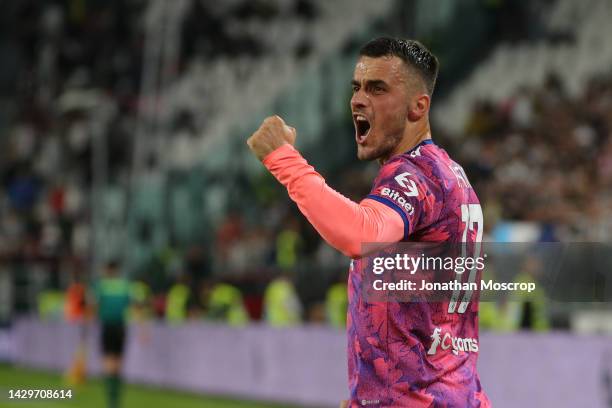 Filip Kostic of Juventus celebrates after scoring to give the side a 1-0 lead during the Serie A match between Juventus and Bologna FC at Allianz...