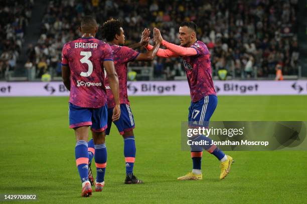 Filip Kostic of Juventus celebrates with team mates Gleison Bremer and Weston McKennie after scoring to give the side a 1-0 lead during the Serie A...