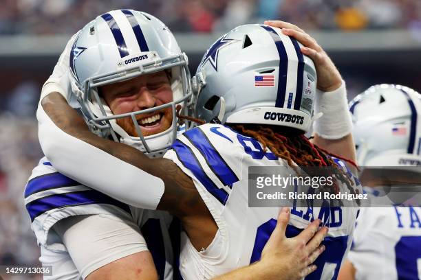 Cooper Rush of the Dallas Cowboys hugs CeeDee Lamb of the Dallas Cowboys after scoring a touchdown during the fourth quarter against the Washington...