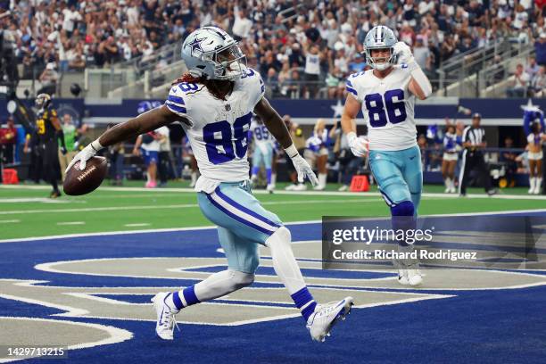 CeeDee Lamb of the Dallas Cowboys celebrates after scoring a touchdown during the fourth quarter against the Washington Commanders at AT&T Stadium on...