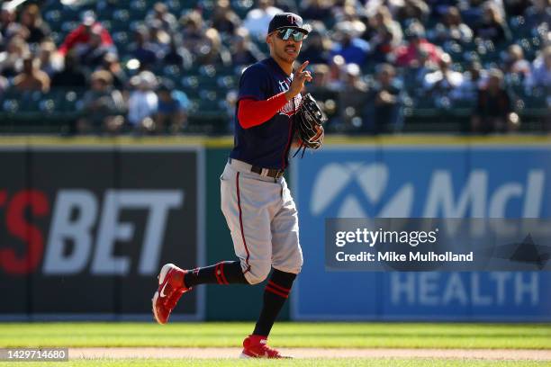 Carlos Correa of the Minnesota Twins runs back to the dugout after recording the last out of the seventh inning during a game against the Detroit...