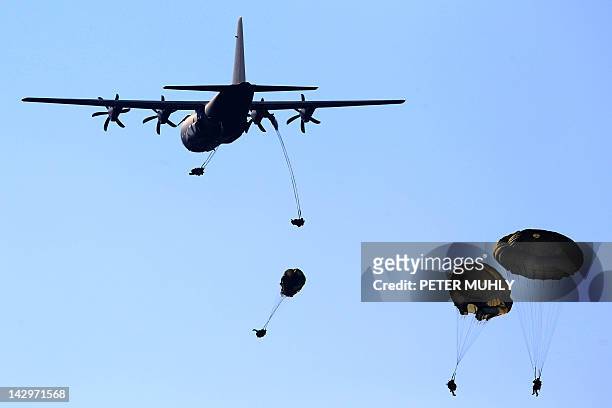 British soldiers from the 3rd Parachute Brigade jump from a C130 Hercules plane during the 16 Air Assault Brigade Exercise Joint Warrior at West...
