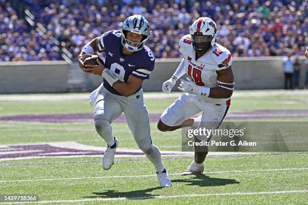 Quarterback Adrian Martinez of the Kansas State Wildcats rushes for a touchdown against linebacker Tyree Wilson of the Texas Tech Red Raiders during...